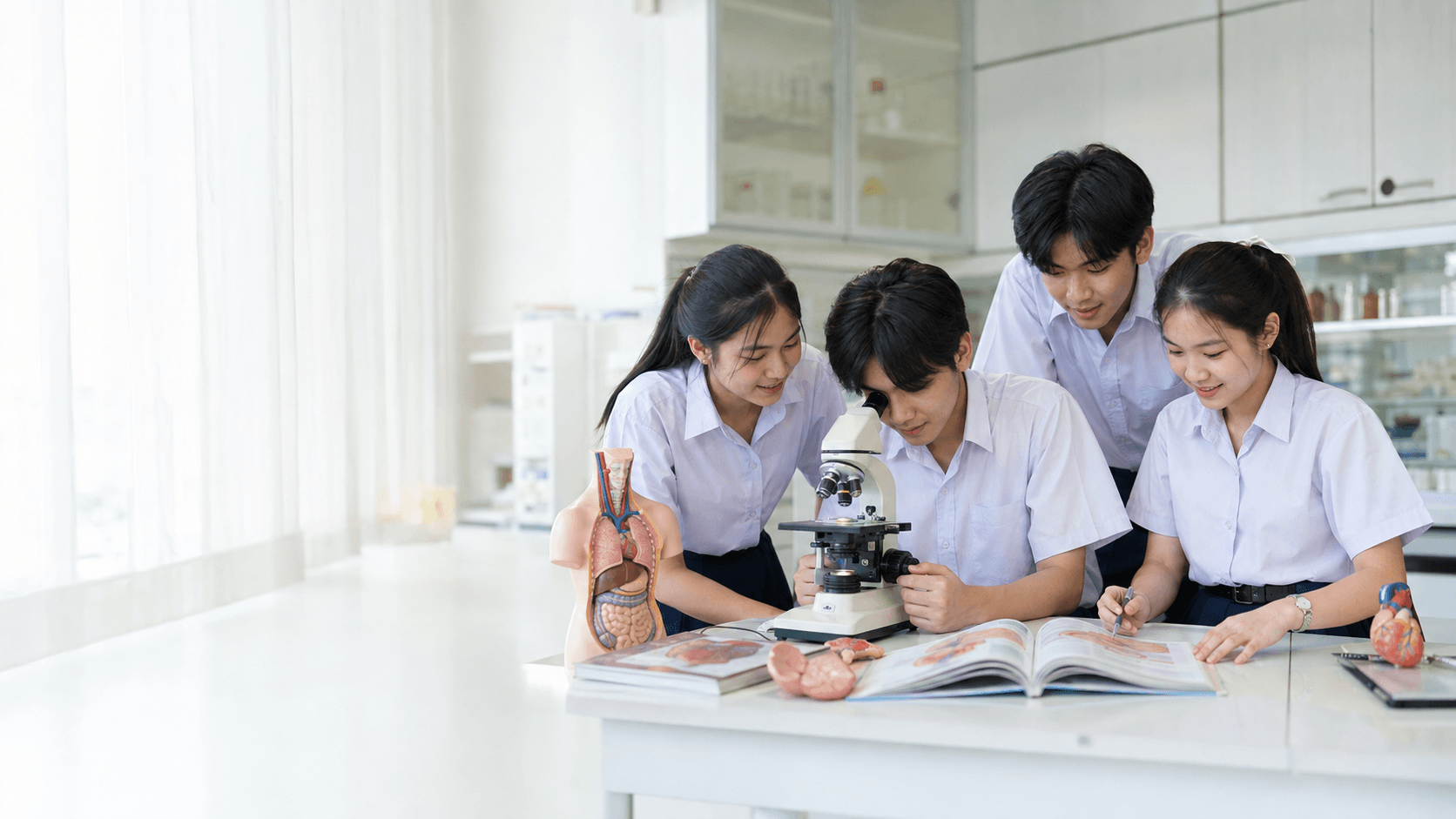 Thai students exploring biology learning materials